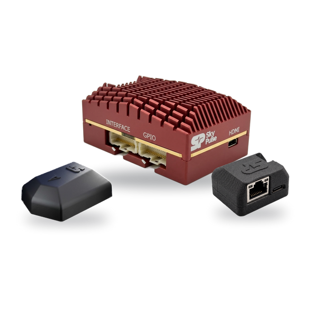 The SkyPulse Evaluation Kit: the Helios FMU at the back, the SkyNav GNSS Module front left and the Breakout Board in its enclosure front right